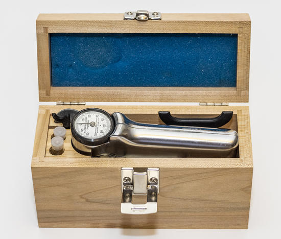 The Barcol Impresser kit #936 housed in its wooden lab bench case